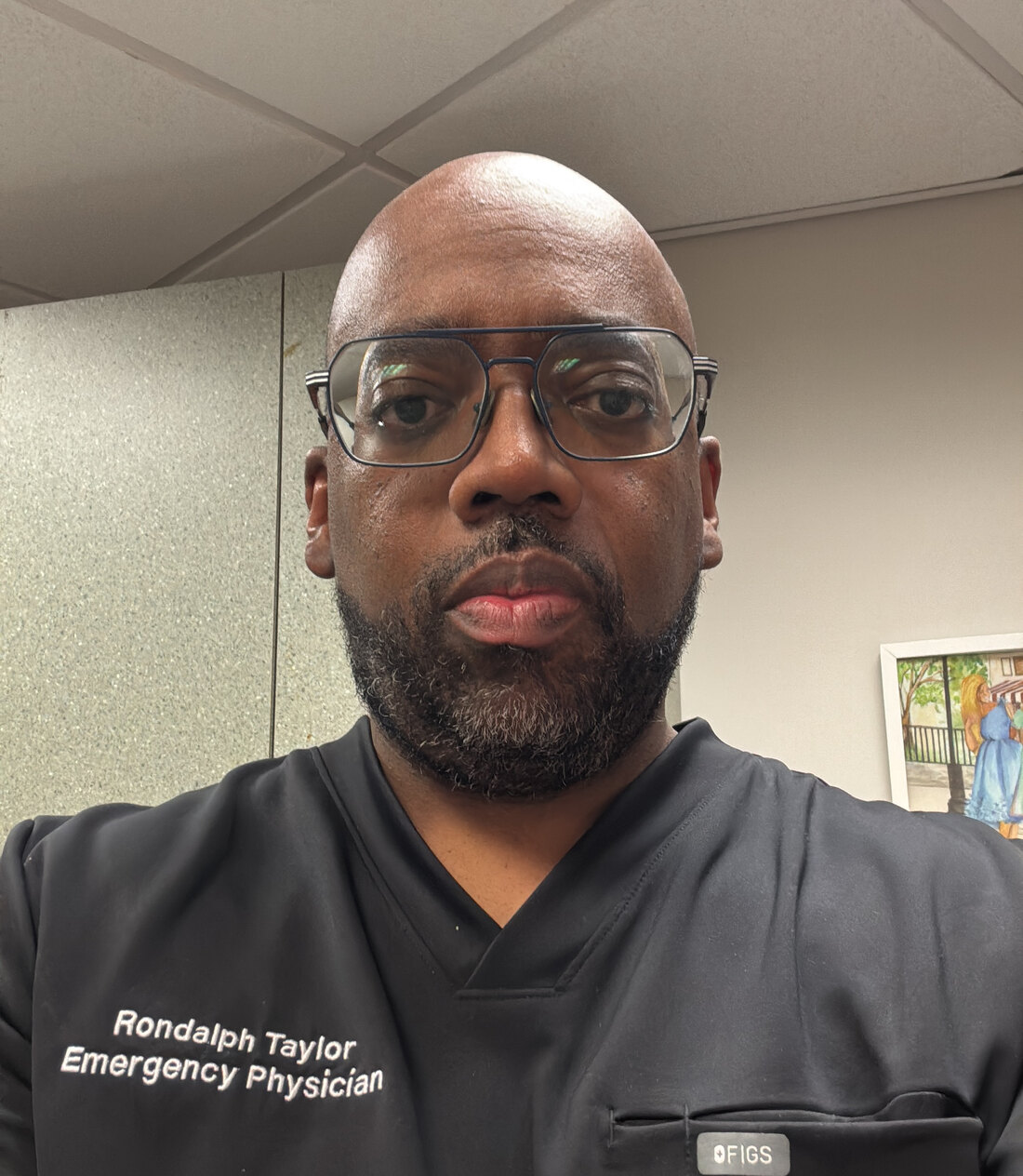 Dr. Rondalph Taylor in emergency-physician scrubs, board-certified ER doctor and founder of Rescu Wellness, Scarsdale NY