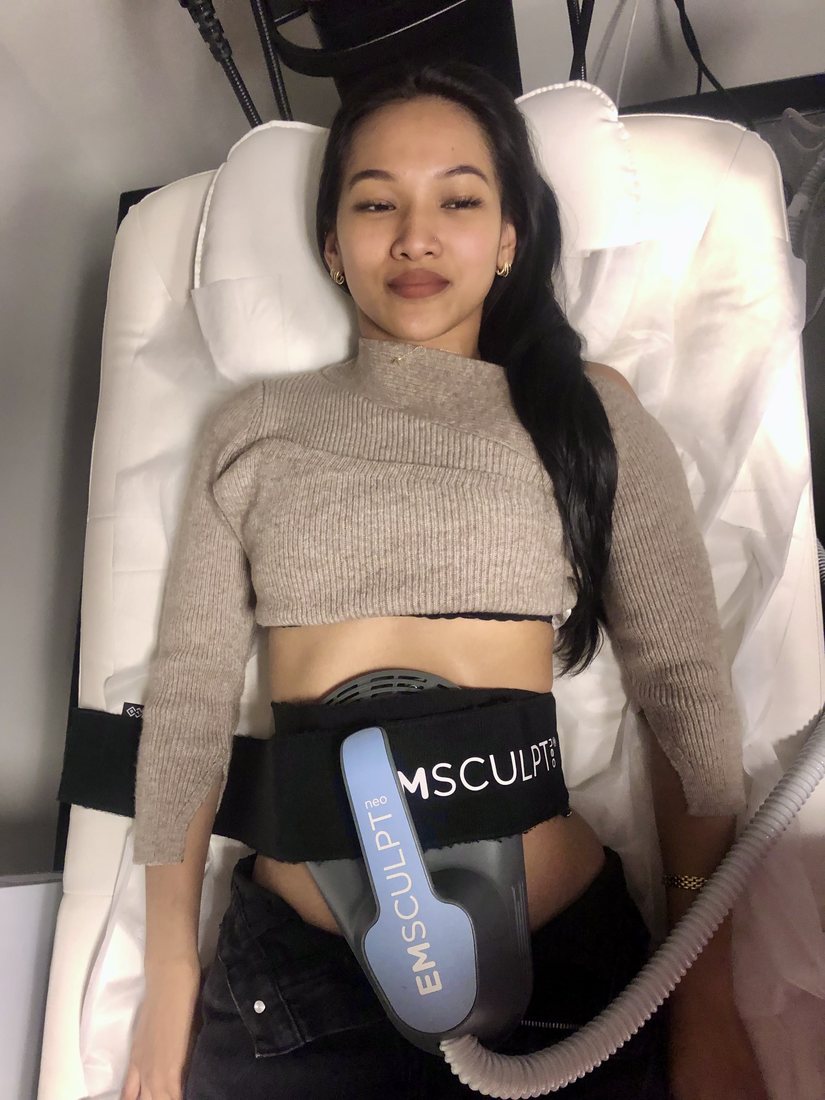 Client during an Emsculpt Neo abdominal session at Rescu Wellness