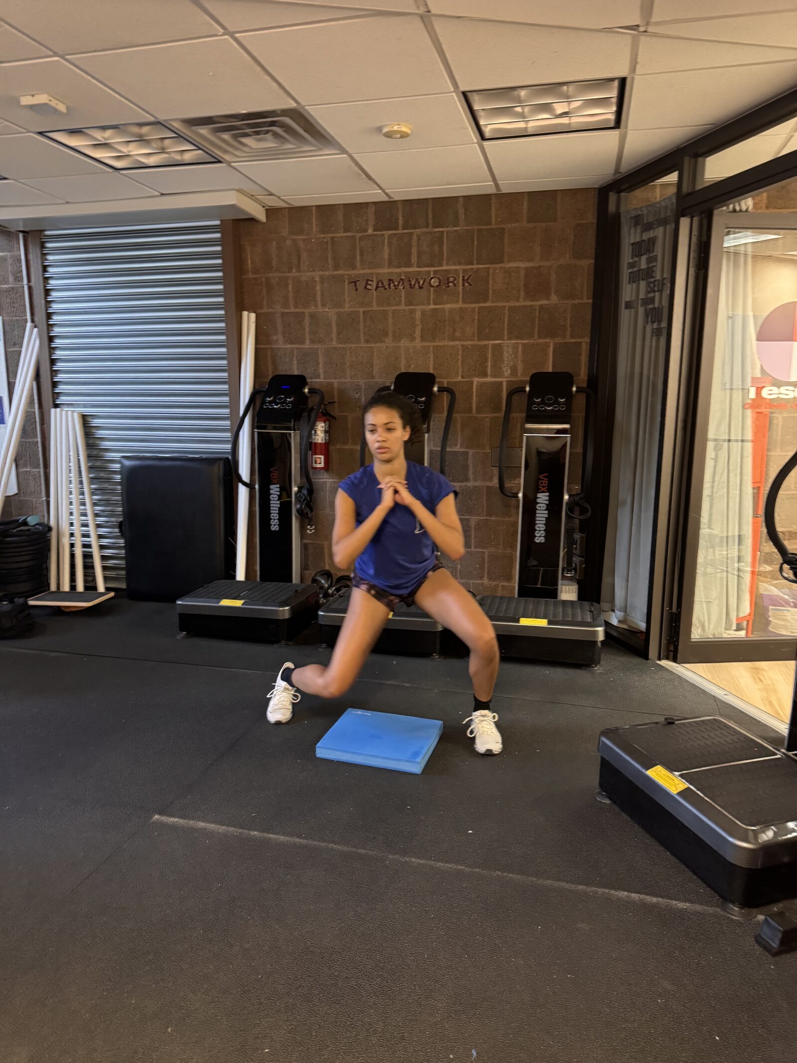 Athlete performing a kettlebell swing at Rescu Performance in Scarsdale