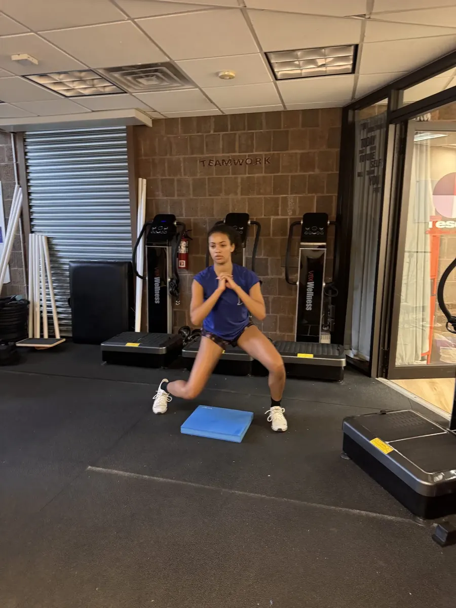 Athlete performing a kettlebell swing at Rescu Performance in Scarsdale