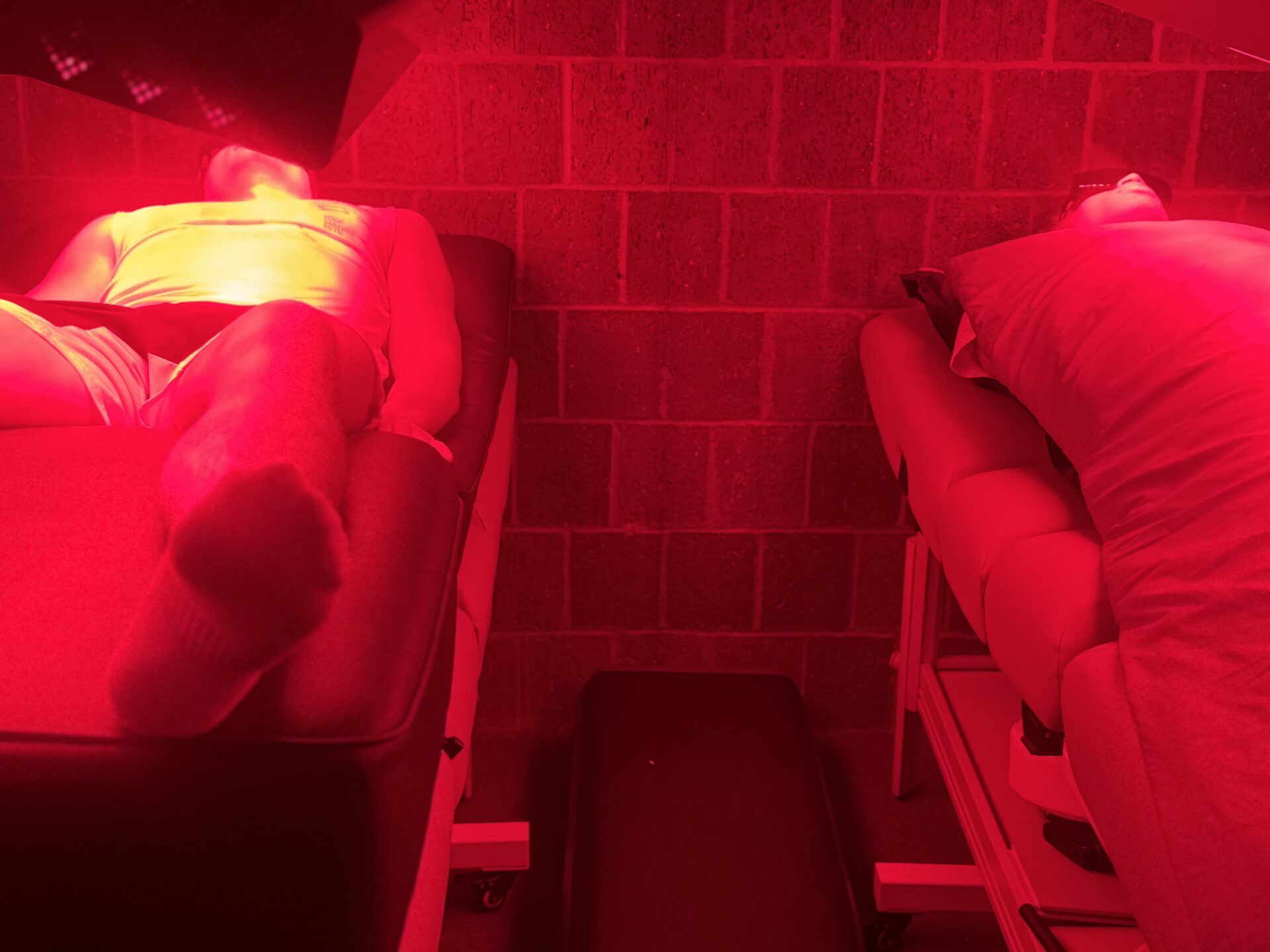 Red light therapy room with treatment tables at Rescu Wellness Scarsdale NY