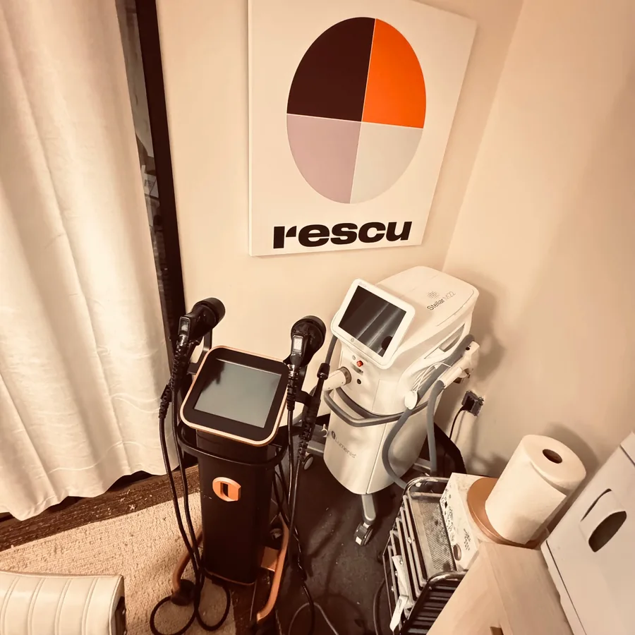Aesthetics equipment beneath the Rescu wall logo
